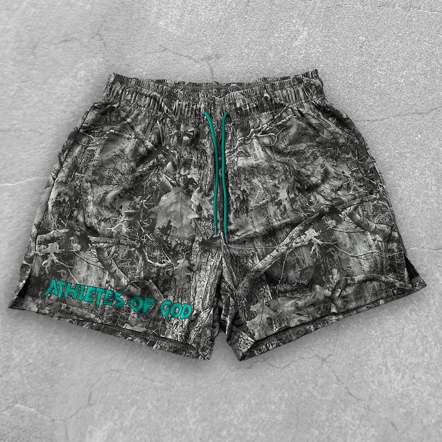 Camo Athletes of God performance shorts with teal drawstrings and wordmark